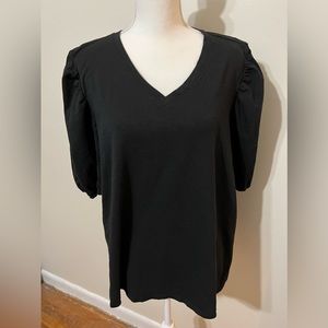 Plus-size top with puff sleeves at shoulders